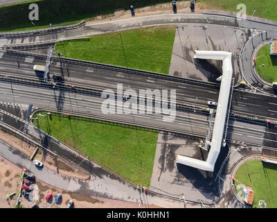 Cars and trucks driving to the entrance to vehicular underground tunnel under the navigable passageway C1. Dam. St. Petersburg, Russia Stock Photo