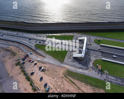 Sandy beach and sea is near the entrance to vehicular underground tunnel under the navigable passageway C1. Dam is in Finnish Gulf. St. Petersburg, Ru Stock Photo