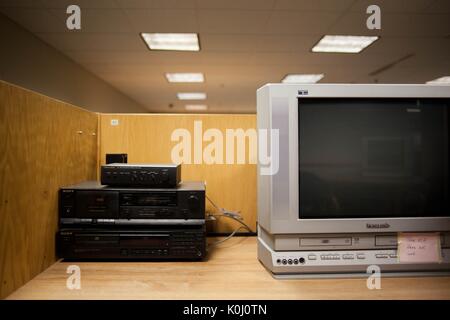 An outdated VCR system connected to a boxy television on a table, 2016. Courtesy Eric Chen. Stock Photo