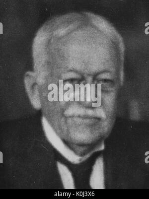 Head shot of original faculty member of Johns Hopkins University Medicine, Samuel Theobald, wearing a dark suit and a dark tie with a white shirt, with a serious facial expression. 1925. Stock Photo