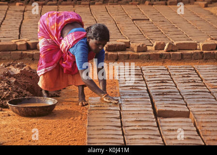 Woman making bricks, Tamil Nadu, India Stock Photo