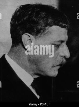 Head shot of original faculty member of Johns Hopkins Medicine, John Whitridge Wililams, wearing a dark suit and a white shirt, a profile shot of the right side of his face, looking downwards with a serious facial expression. 1916. Stock Photo