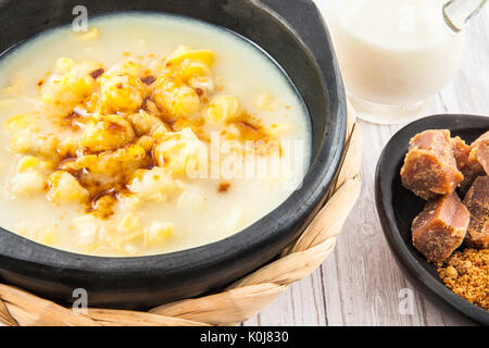 Traditional Colombian corn mazamorra served in black ceramic dish Stock Photo