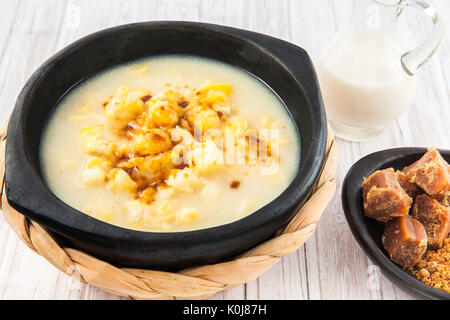 Traditional Colombian corn mazamorra served in black ceramic dish Stock Photo