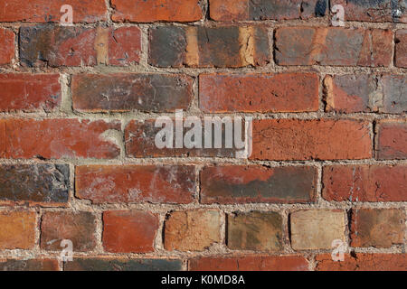 Old decaying cracked brick wall texture background closeup Stock Photo