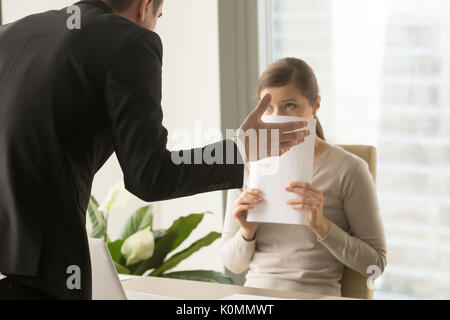 Angry irritated boss reprimanding employee, verbal warning about Stock Photo