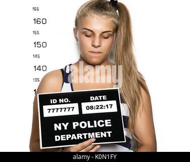 Mugshot of a beautiful young woman criminal Stock Photo - Alamy