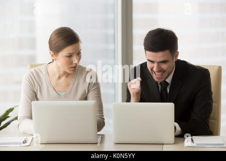 Envious employee feeling jealous about success and achievements  Stock Photo