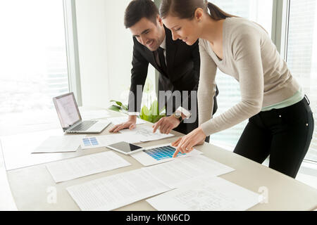 Smiling professional designers working on project, residential i Stock Photo