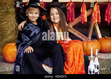 Siblings celebrating great Halloween party Stock Photo