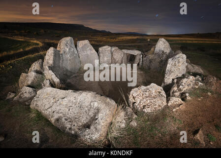 Starry night in a prehistoric megalithic dolmen in Mazariegos, Burgos, Spain. Stock Photo