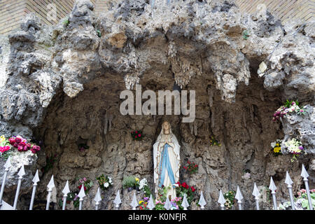 Holy Mary statue in chapel with the appearance of a grotto. Stock Photo