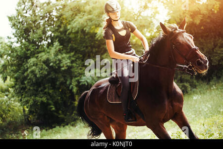 Portrait of young woman riding her horse Stock Photo