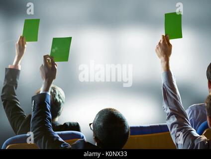 Digital composite of Business conference people holding green cards Stock Photo