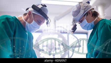 Digital composite of Doctors standing with 3D DNA strands Stock Photo