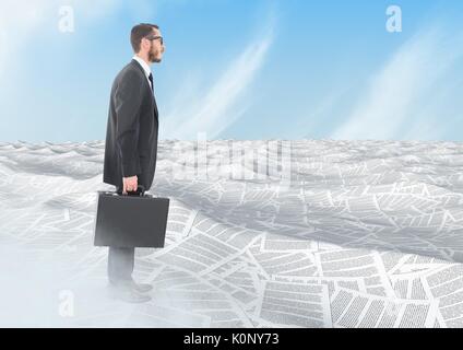 Digital composite of Businessman holding briefcase in sea of documents under sky clouds Stock Photo