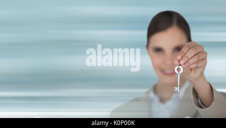 Digital composite of Business woman holding keys Stock Photo