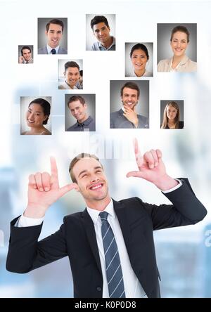 Digital composite of Businessman interacting and choosing a person from group of people interface Stock Photo