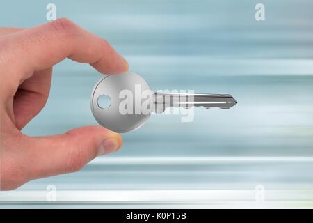 Digital composite of Hand holding keys Stock Photo