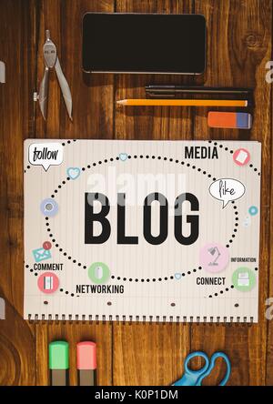 Digital composite of Table top with a notebook with web graphics Stock Photo