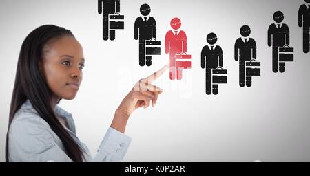 Digital composite of Businesswoman interacting and choosing a person from group of people icons Stock Photo
