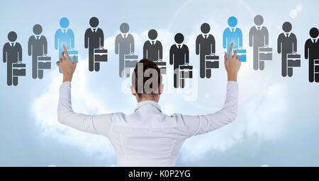 Digital composite of Businesswoman interacting and choosing a person from group of people icons Stock Photo