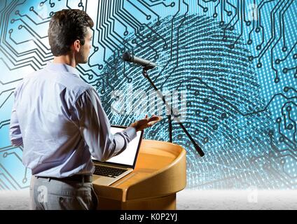 Digital composite of Businessman on podium speaking at conference with finger print science and technology background Stock Photo