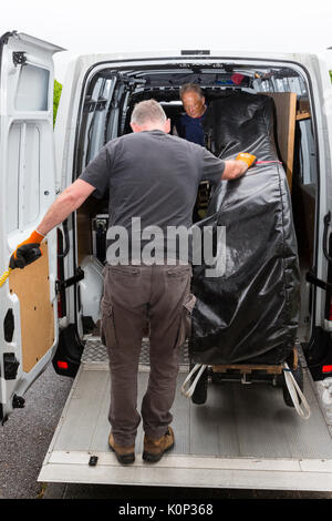 Steinway Grand Piano being moved into a church, Ireland Stock Photo