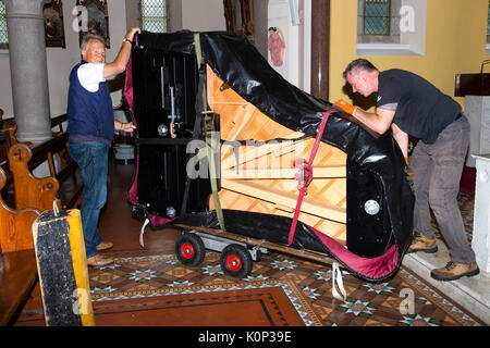 Steinway Grand Piano being moved into a church, Ireland Stock Photo