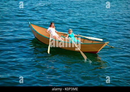 Two women rowing a Lunenburg dory boat Stock Photo