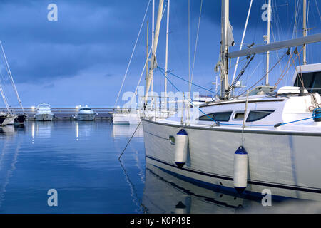 evening relaxing time on sailing boat in the harbor Stock Photo