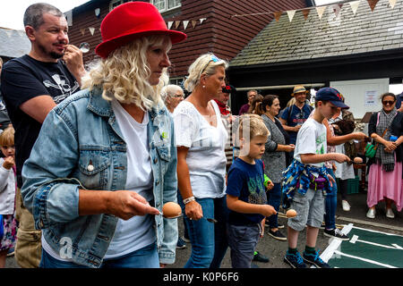 Women and Children Take Part In A Traditional Egg and Spoon Race, The Annual South Street Sports Day and Dog Show, Lewes, East Sussex, UK Stock Photo