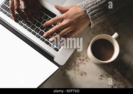 Close-up of woman using laptop Stock Photo