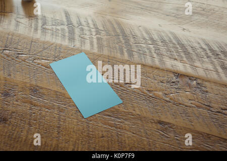 Close up of paper on wooden table Stock Photo