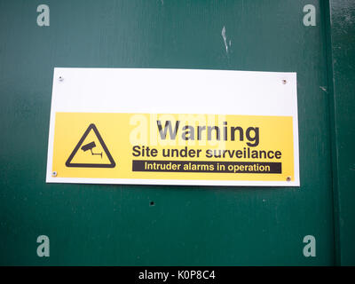 construction site warning site under surveillance cctv; England; UK Stock Photo