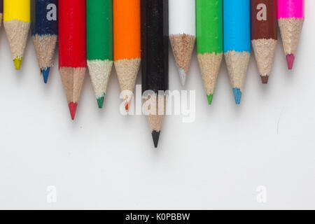 Close-up of a group of multicolored pencils on a white background Stock Photo