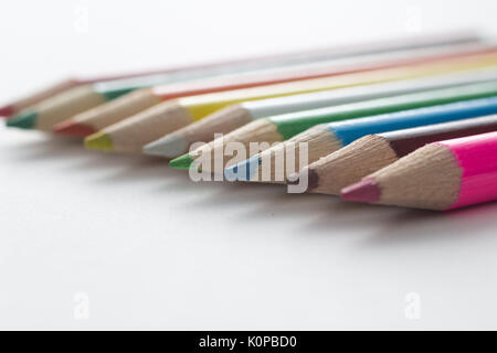 Close-up of a group of multicolored pencils on a white background Stock Photo