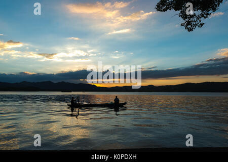People doing things by the lake, evening, happy candid Stock Photo