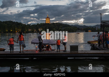 People doing things by the lake, evening, happy candid Stock Photo