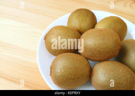 Kiwi closed up on white background Stock Photo - Alamy