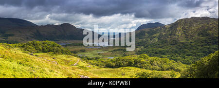 Ladies View is a scenic overlook along the N71 portion of the Ring of Kerry, in Killarney National Park, Ireland. The name apparently stems from the a Stock Photo