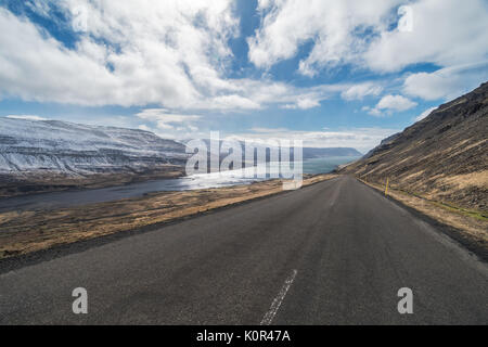 Looking down the road at dramatic scenery, isolation, Kollafjordur, Westfjords, Iceland Stock Photo