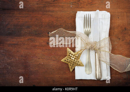 Christmas table setting with decoration on wooden background Stock Photo