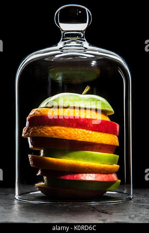 Fruit slices on black background Stock Photo