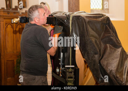 Steinway Grand Piano being moved into a church, Ireland Stock Photo