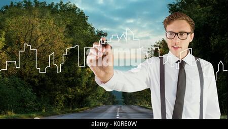 Digital composite of Man drawing a city on the road Stock Photo