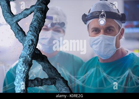 Digital composite of Doctors standing with 3D DNA strands Stock Photo