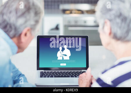 Human representations with live support text against senior couple looking at laptop at home Stock Photo