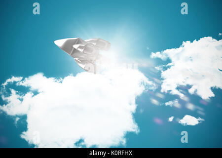 Low angle view of silver colored space ship against dark blue background Stock Photo