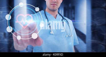 Surgeon pretending to be using futuristic digital screen against vacant corridor Stock Photo